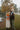 Family of four by a lake on a cloudy day.